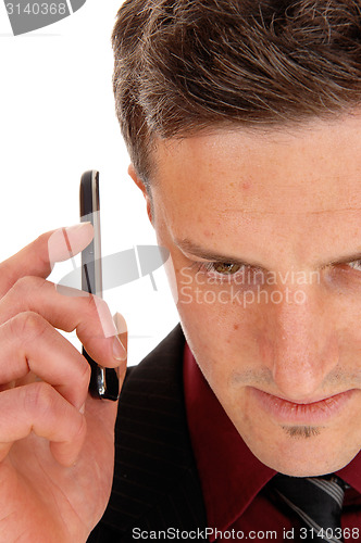 Image of Man holding cell phone.