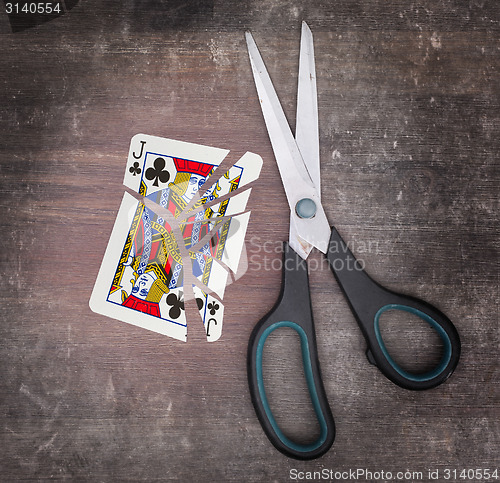 Image of Concept of addiction, card with scissors