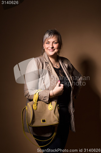 Image of portrait of beautiful plus size curly young blond woman