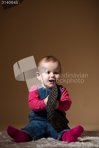 Image of infant baby with black hat