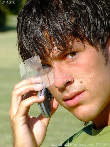 Image of Young man with mobile