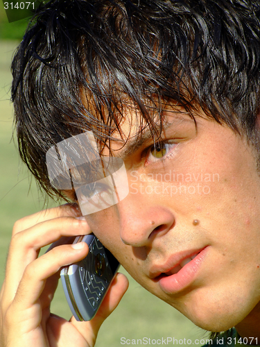 Image of Young man with mobile