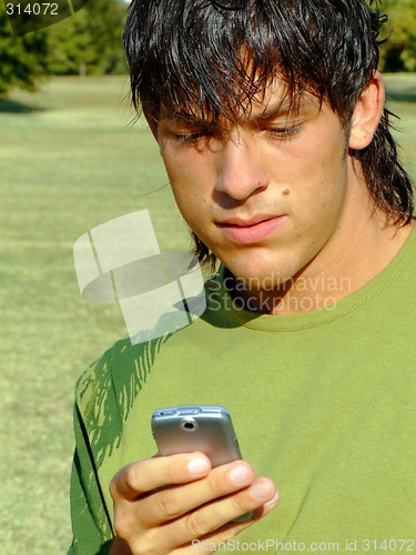 Image of Young man with mobile