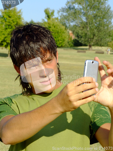 Image of Young man with mobile