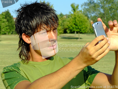 Image of Young man with mobile