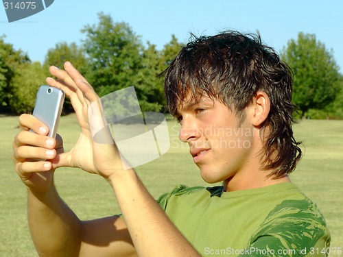 Image of Young man with mobile