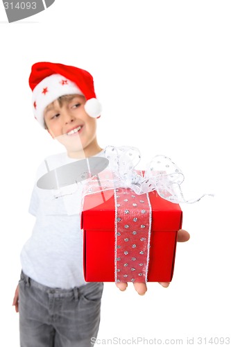 Image of Boy with present looking sideways