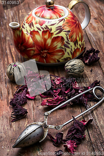 Image of teapot in the background of elite sorts of tea