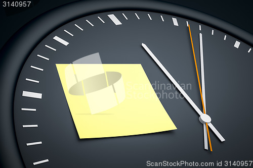 Image of clock with sticky note