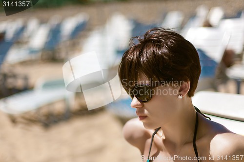 Image of Sexy young woman on the beach
