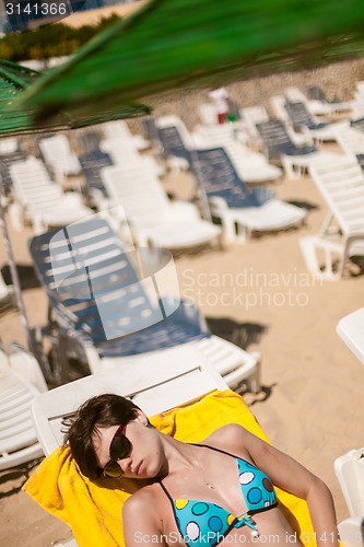 Image of Sexy young woman on the beach