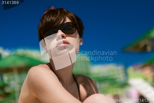 Image of Sexy young woman on the beach
