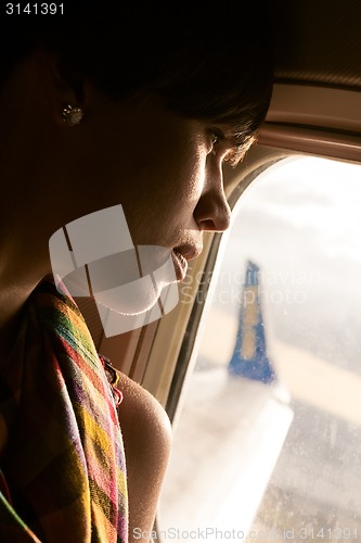 Image of female airplane passanger enjoying the view