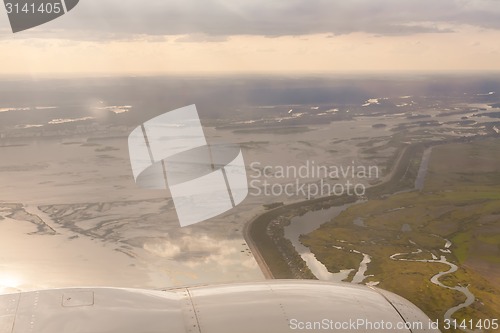 Image of earth and plane wing view