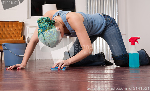 Image of Blue Collar Worker Maid Doing Cleaning Chores Scrubbing Floor