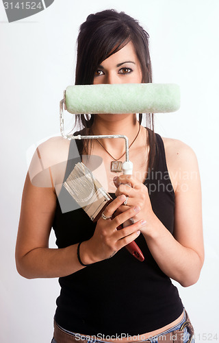 Image of Hip Fun Attractive Woman Holding Painting Tools Brush Roller