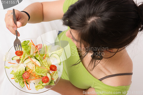 Image of Healthy Eating Woman Enjoys Raw Food Fresh Green Salad