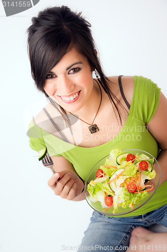 Image of Healthy Eating Woman Enjoys Raw Food Fresh Green Salad