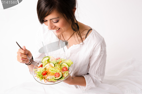 Image of Healthy Eating Woman Enjoys Raw Food Fresh Green Salad