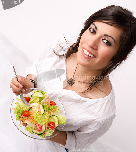 Image of Healthy Eating Woman Enjoys Raw Food Fresh Green Salad