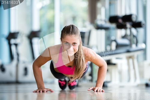 Image of warming up and doing some push ups a the gym