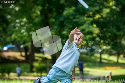 Image of boy with airpane toy