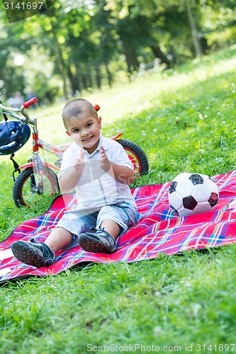 Image of boy with airpane toy