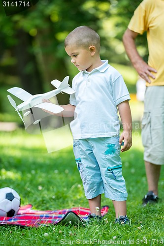 Image of grandfather and child have fun  in park