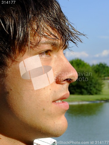 Image of Close-up of a young man at the park