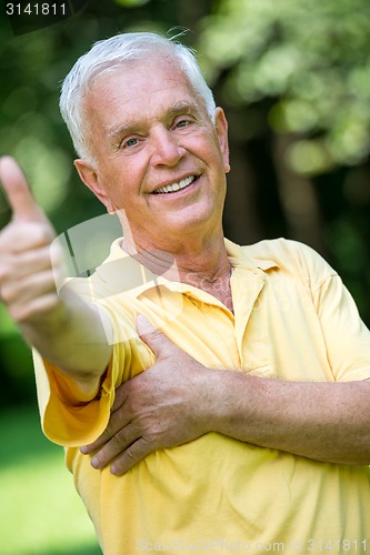 Image of Portrait of smiling elderly man