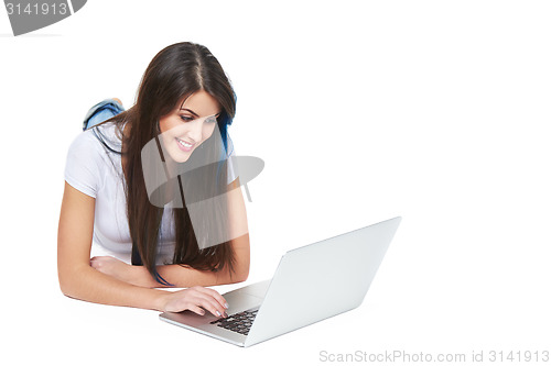 Image of Woman lying on the floor with laptop