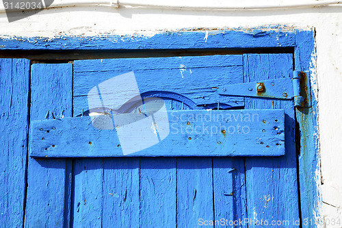 Image of morocco in africa the old wood  facade rusty safe padlock 