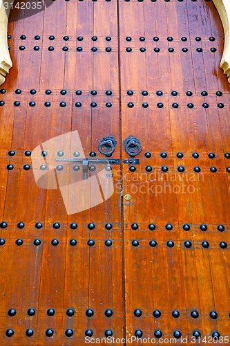 Image of grey metal rusty      morocco in   facade home and safe padlock 