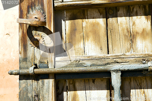 Image of metal rusty  brown     in africa the old   home and safe padlock