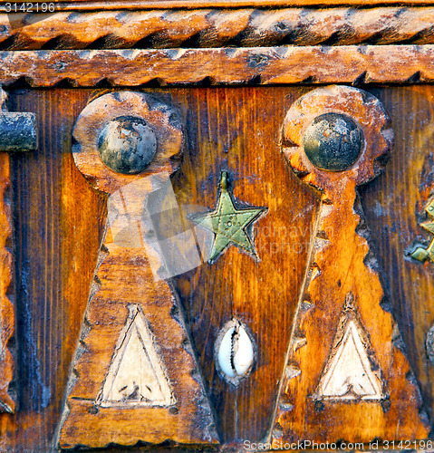 Image of grey metal rusty      morocco in africa the old wood  shell padl