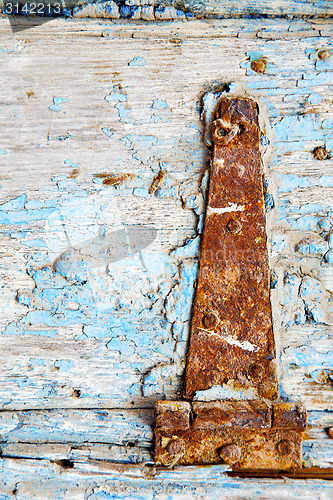 Image of morocco in  old wood  facade home and rusty safe padlock 