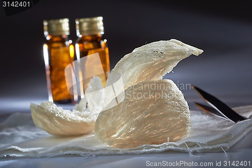 Image of Edible birdnest with essence bottle and pincer