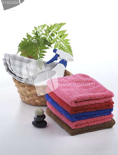 Image of Towel and stone with relaxing setting