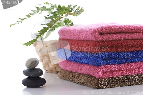 Image of Towel and stone with relaxing setting