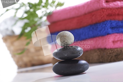 Image of Towel and stone with relaxing setting