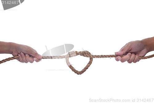 Image of Two hand pulling a rope with heart shape