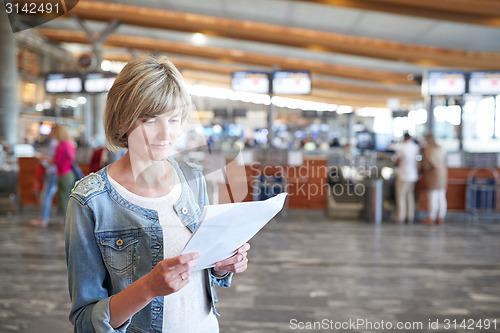 Image of Woman with backpack going on boarding