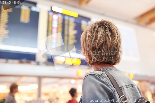 Image of Woman with backpack going on boarding