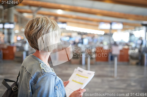 Image of Woman with backpack going on boarding