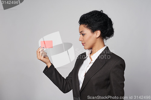 Image of Business woman showing blank credit card