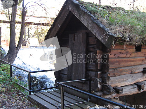 Image of Small house by the water