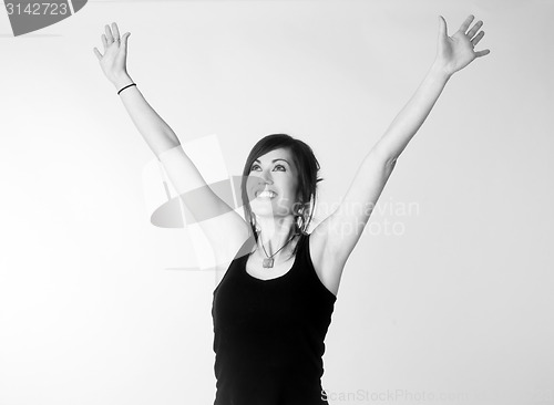 Image of Woman Celebrates Winning Attitude Arms Outstretched Reaching Upw