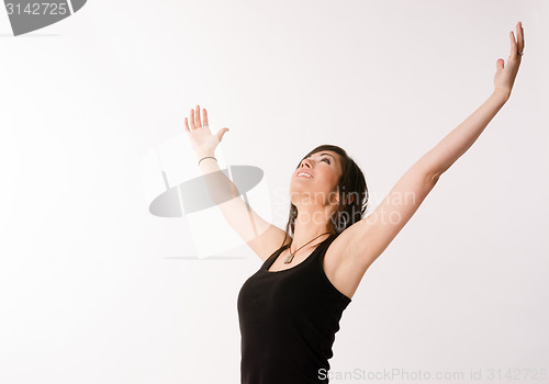 Image of Woman Celebrates Winning Attitude Arms Outstretched Reaching Upw