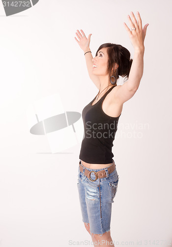 Image of Woman Celebrates Winning Attitude Arms Outstretched Reaching Upw