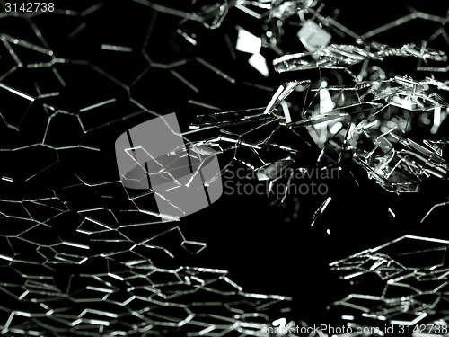 Image of Destructed or broken glass pieces on black background